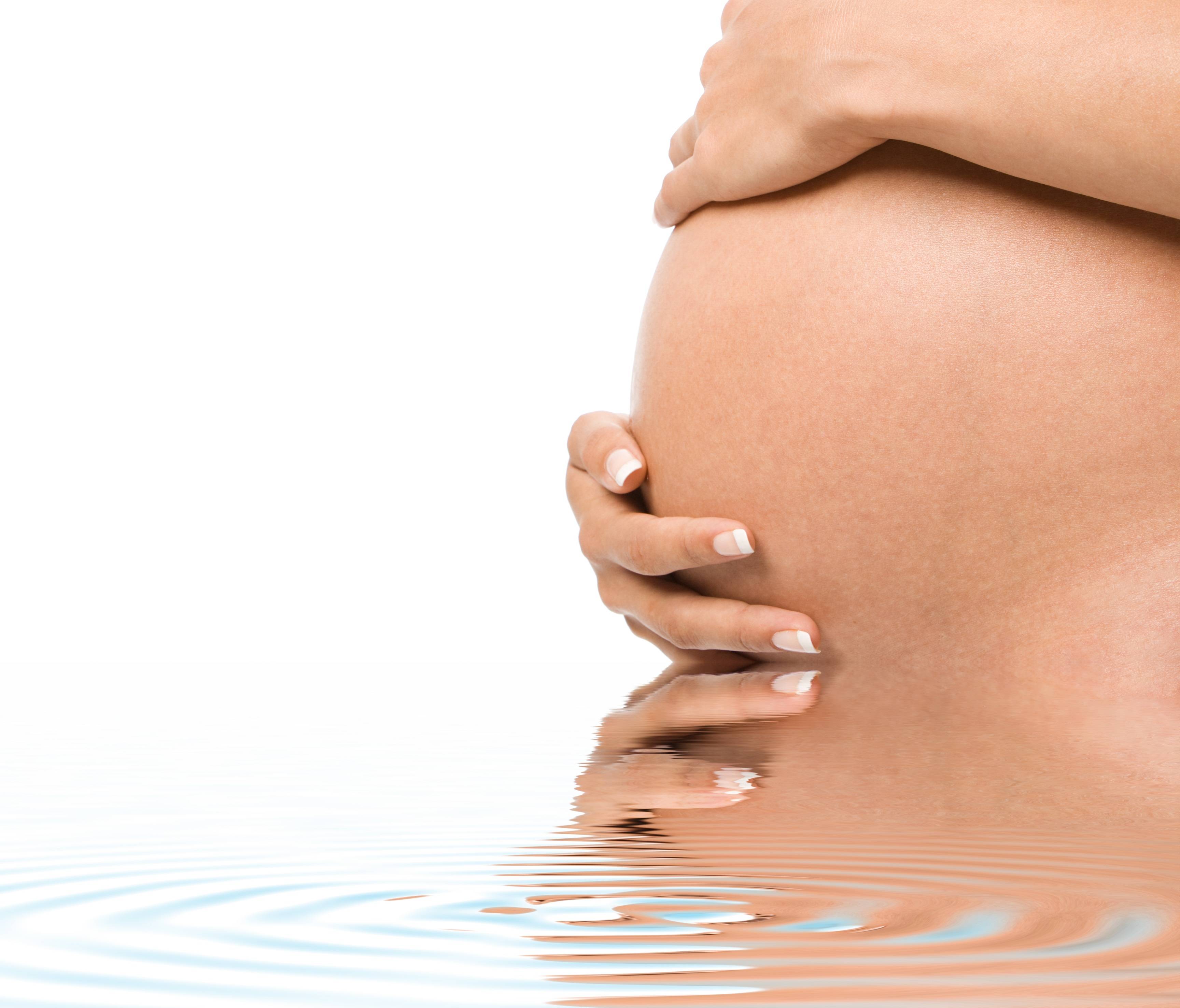 pregnant women belly in water